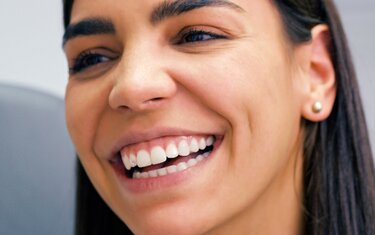 A female dental patient wearing Ivoclar Skyce professional tooth jewellery